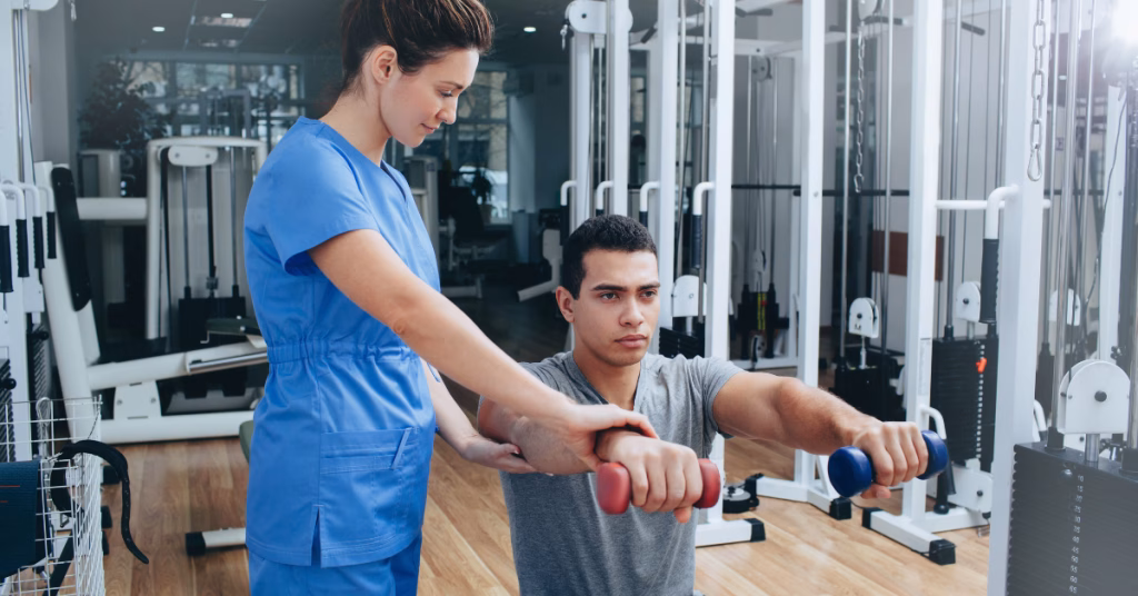 a physiotherapist assisting an athlete during a recovery rehabilitation in a physical therapy clinic facility